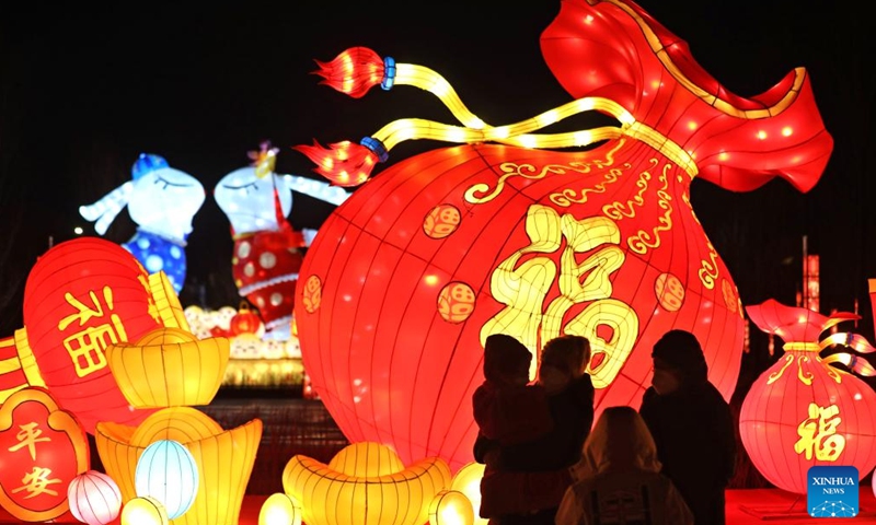 Tourists enjoy Chinese lanterns in front of the Shenyang Palace Museum in Shenyang, capital of northeast China's Liaoning Province, Jan. 15, 2023. As the Year of the Rabbit approaches, various colourful Chinese lanterns appeared at the core area of the ancient city of Shenyang, attracting many citizens and tourists here to enjoy lively Spring Festival atmosphere.(Photo: Xinhua)