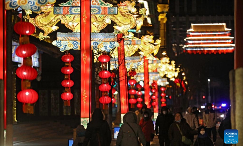 Tourists enjoy Chinese lanterns in front of the Shenyang Palace Museum in Shenyang, capital of northeast China's Liaoning Province, Jan. 15, 2023. As the Year of the Rabbit approaches, various colourful Chinese lanterns appeared at the core area of the ancient city of Shenyang, attracting many citizens and tourists here to enjoy lively Spring Festival atmosphere.(Photo: Xinhua)
