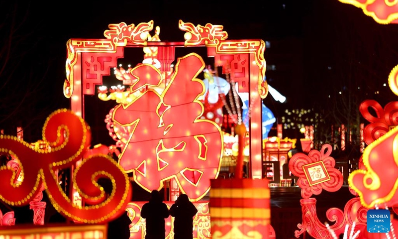 Tourists take photos of Chinese lanterns in front of the Shenyang Palace Museum in Shenyang, capital of northeast China's Liaoning Province, Jan. 15, 2023. As the Year of the Rabbit approaches, various colourful Chinese lanterns appeared at the core area of the ancient city of Shenyang, attracting many citizens and tourists here to enjoy lively Spring Festival atmosphere.(Photo: Xinhua)