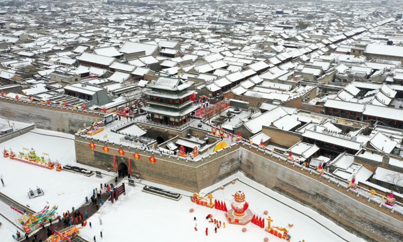 This aerial photo taken on Jan. 14, 2023 shows the snow scenery of Pingyao Ancient Town in Jinzhong City, north China's Shanxi Province.(Photo: Xinhua)