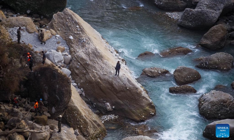 Rescuers work at the crash site of a passenger plane near Pokhara, Nepal, on Jan. 17, 2023. With the second body recovered at the crash site of a Nepali passenger plane in central Nepal on Tuesday, 71 bodies had been found with the last missing victim remains to be confirmed, an official said.(Photo: Xinhua)