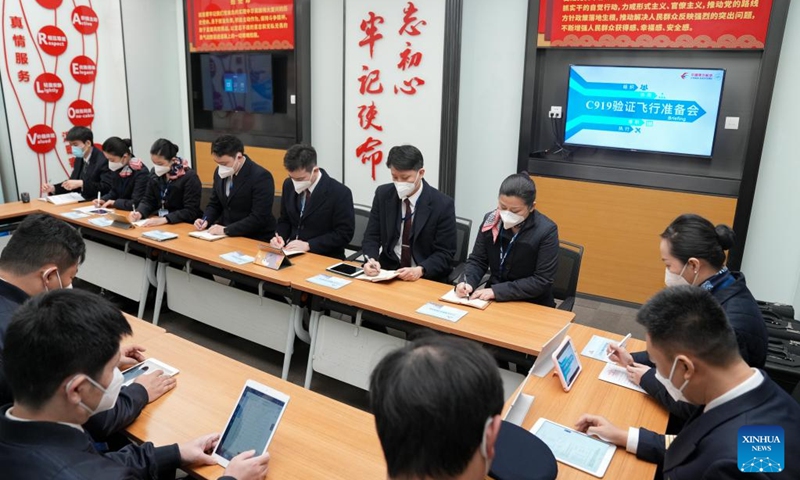 Crew members of China Eastern Airlines have a meeting before a validation flight of a C919 large passenger aircraft, China's first homegrown large jetliner, in east China's Shanghai, Jan. 9, 2023. The world's first C919 aircraft began its 100-hour aircraft validation flight process on Dec. 26, 2022 after it was delivered to China Eastern Airlines on Dec. 9, 2022.(Photo: Xinhua)