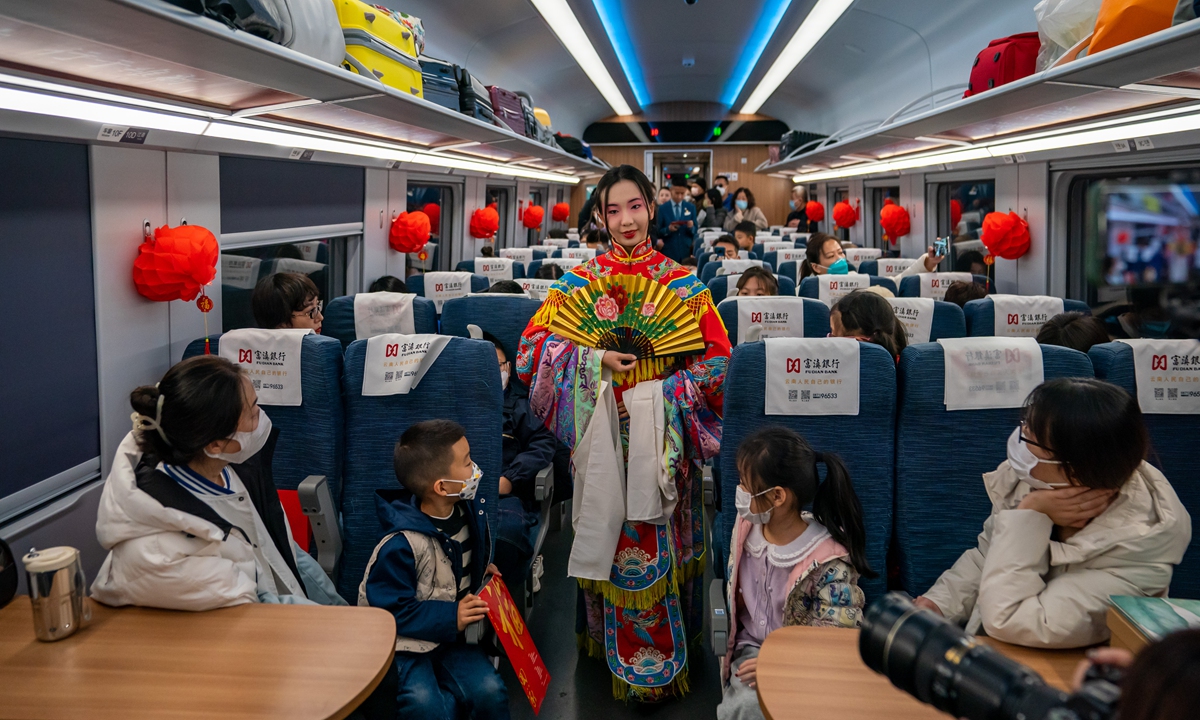 To welcome the Spring Festival which falls on January 22, 2023, Peking Opera actors perform excerpts from The Drunken Concubine on the train of the China-Laos Railway on January 19. Photo: Xinhua