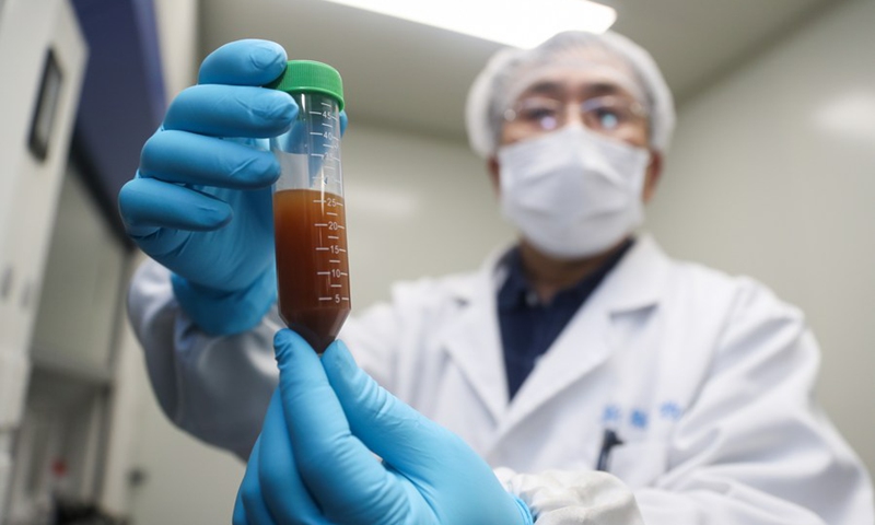 A researcher of Stermirna Therapeutics Co., Ltd. shows the experiment to develop an mRNA vaccine targeting the novel coronavirus in east China's Shanghai, Jan. 29, 2020.(Photo: Xinhua) 