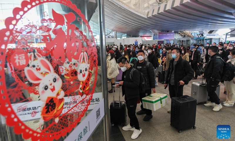 Passengers line up to board trains at Shenzhen North railway station in Shenzhen, south China's Guangdong Province, Jan. 18, 2023. Photo: Xinhua