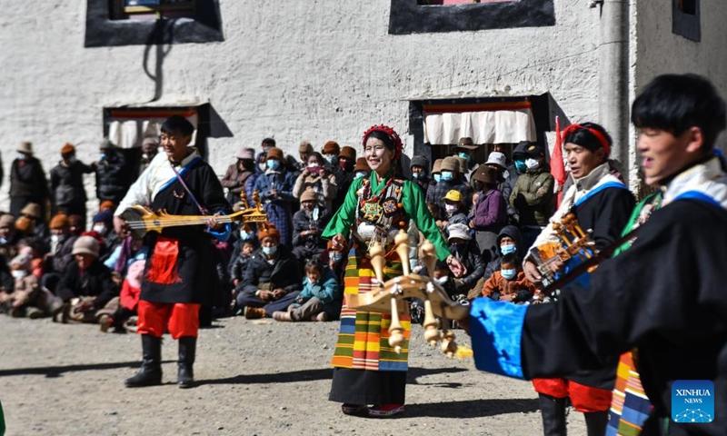 Actors play musical instruments during a village gala performance to celebrate Sonam Losar and the Spring Festival in Pucun Village, Mangpu Township of Xigaze, southwest China's Tibet Autonomous Region, Jan. 21, 2023. (Xinhua/Jigme Dorje)