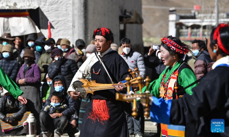Actors play musical instruments during a village gala performance to celebrate Sonam Losar and the Spring Festival in Pucun Village, Mangpu Township of Xigaze, southwest China's Tibet Autonomous Region, Jan. 21, 2023. (Xinhua/Jigme Dorje)
