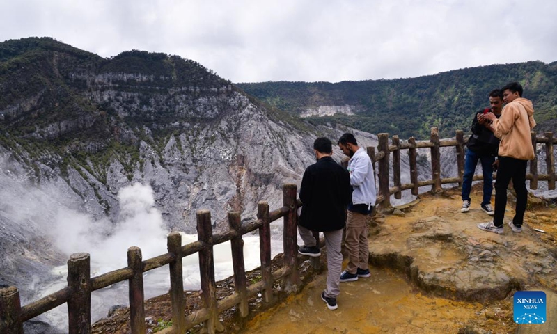People visit Tangkuban Parahu, a volcano near the city of Bandung, Indonesia on Jan. 22, 2023. The Tangkuban Perahu volcano has attracted many visitors during the Spring Festival holiday in Indonesia. The Chinese Lunar New Year, or Spring Festival, falls on Sunday. (Xinhua/Xu Qin)