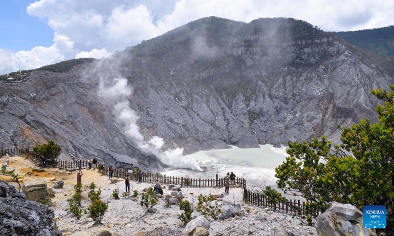 People visit Tangkuban Parahu, a volcano near the city of Bandung, Indonesia on Jan. 22, 2023. The Tangkuban Perahu volcano has attracted many visitors during the Spring Festival holiday in Indonesia. The Chinese Lunar New Year, or Spring Festival, falls on Sunday. (Xinhua/Xu Qin)