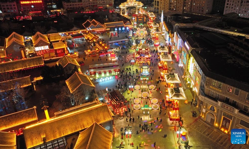 This aerial photo taken on Jan. 23, 2023 shows people visiting Huangsi Temple Fair during the Spring Festival holiday in Shenyang, capital of northeast China's Liaoning Province. Various activities were held here at the 6-day fair, starting from Jan. 22, to celebrate the Spring Festival. (Xinhua/Yang Qing)