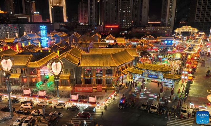 This aerial photo taken on Jan. 23, 2023 shows people visiting Huangsi Temple Fair during the Spring Festival holiday in Shenyang, capital of northeast China's Liaoning Province. Various activities were held here at the 6-day fair, starting from Jan. 22, to celebrate the Spring Festival. (Xinhua/Yang Qing)