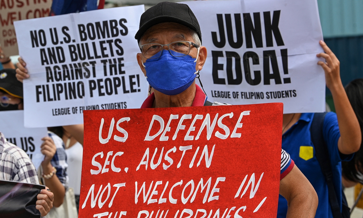 Philippine protesters hold anti-US placards during a rally in front of the military headquarters in Quezon City, suburban Manila on February 2, 2023, during US Secretary of Defense Lloyd Austin's visit to the Philippines. The two countries announced a deal on February 2 that will give US troops access to another four bases in the Southeast Asian country. Photo: AFP