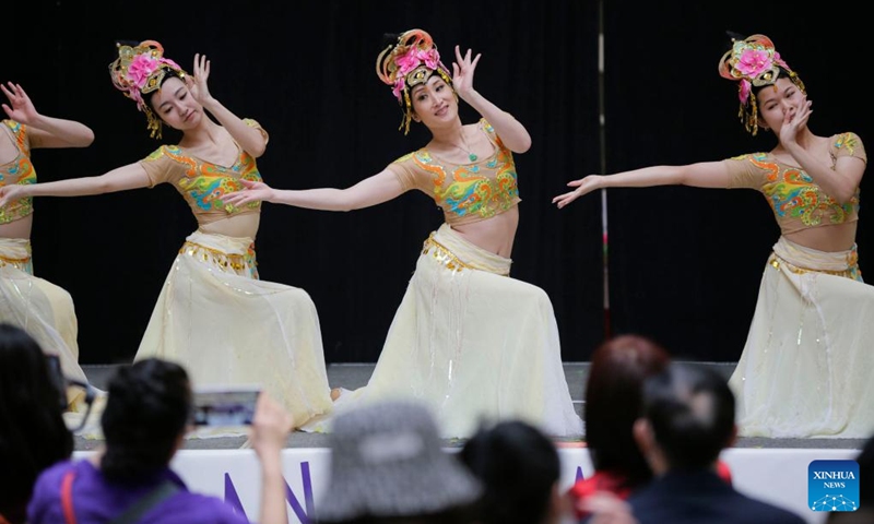 Dancers perform during the Chinese New Year celebration event at Lansdowne Centre in Richmond, British Columbia, Canada, Jan. 28, 2023. The event features a wide variety of cultural activities that allow the audience to experience the traditional culture of the Chinese New Year. (Photo by Liang Sen/Xinhua)