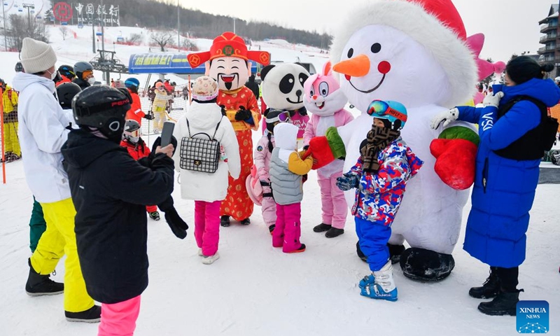 Children have fun at the Lake Songhua Resort in Jilin City, northeast China's Jilin Province, Jan. 23, 2023. Driven by the 2022 Beijing Winter Olympics, ice-and-snow tourism has gradually gained popularity among Chinese people, and northeast China is among the top destinations due to its cold winter.(Photo: Xinhua)