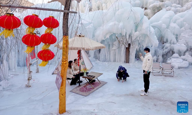 Tourists take photos at Tianheshan scenic spot of Xingtai City, north China's Hebei Province, Jan. 27, 2023. Xingtai has developed ice and snow tourism to boost local economy in recent years.(Photo: Xinhua)