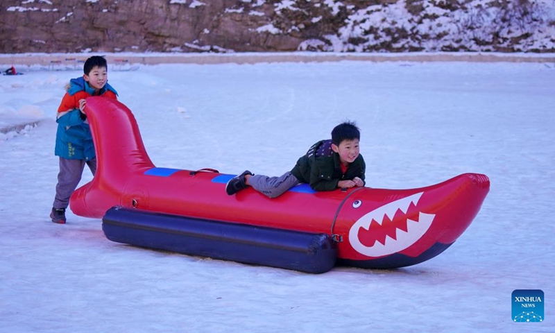 Tourists have fun at Tianheshan scenic spot of Xingtai City, north China's Hebei Province, Jan. 27, 2023. Xingtai has developed ice and snow tourism to boost local economy in recent years.(Photo: Xinhua)