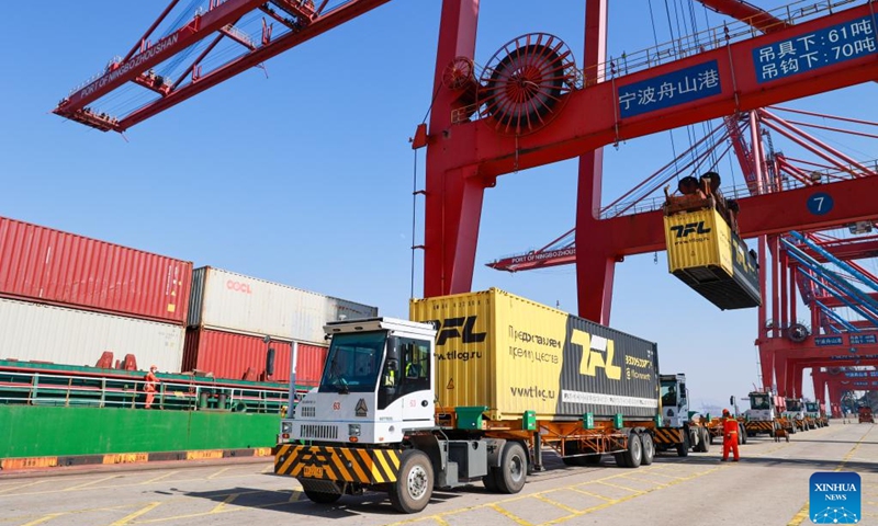 The crane lifts a container at the Ningbo-Zhoushan port in Ningbo, east China's Zhejiang Province, Jan. 30, 2023.(Photo: Xinhua)