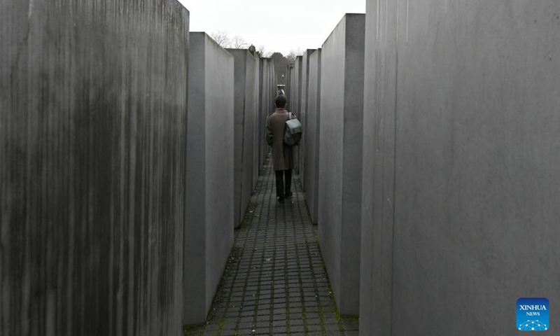 A man visits the Memorial to the Murdered Jews of Europe in Berlin, Germany, Jan. 27, 2023. The memorial, located in the center of Berlin, was built to remember about 6 million Jews killed by the Nazis during World War II. In 2005, the UN General Assembly adopted a resolution which designated Jan. 27 as the International Day of Commemoration in Memory of the Victims of the Holocaust.(Photo: Xinhua)