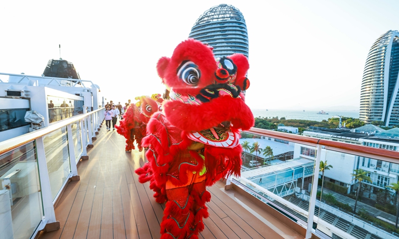 Guests follow a troupe of lion dancing performance on <em>CM-Yidun</em> during its Spring Festival cruise in Sanya, South China's Hainan Province on January 20, 2023. Photo: courtesy of Viking Cruises