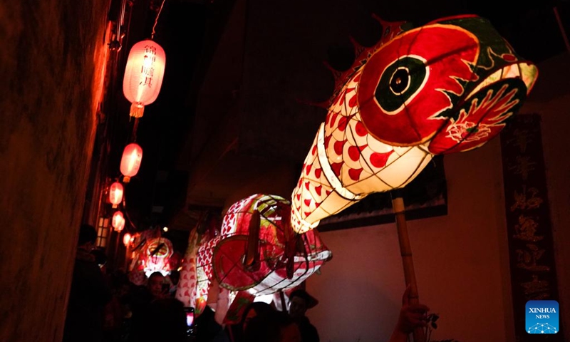People holding fish-shaped lanterns parade during the new year celebrations in Shexian County of Huangshan City, east China's Anhui Province, Jan. 31, 2023.(Photo: Xinhua)