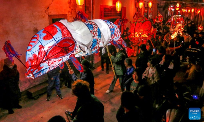 People holding fish-shaped lanterns parade during the new year celebrations in Shexian County of Huangshan City, east China's Anhui Province, Jan. 31, 2023.(Photo: Xinhua)