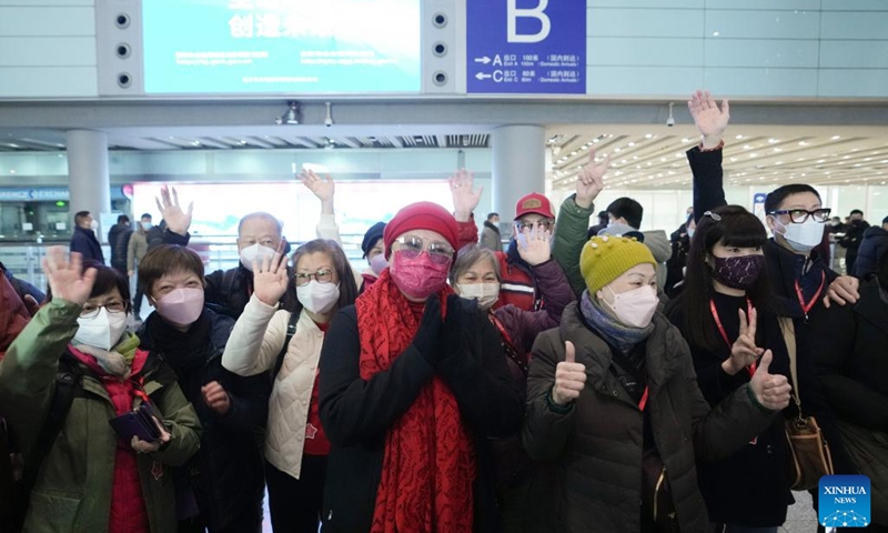 Tourists of the first tour group from Hong Kong attend a welcoming ceremony at Beijing Capital International Airport in Beijing, capital of China, Feb. 6, 2023. The Chinese mainland fully resumed normal travel with the Hong Kong and Macao special administrative regions (SARs) starting Monday, in what is expected to be a strong boost for the two regions' economic development.(Photo: Xinhua)
