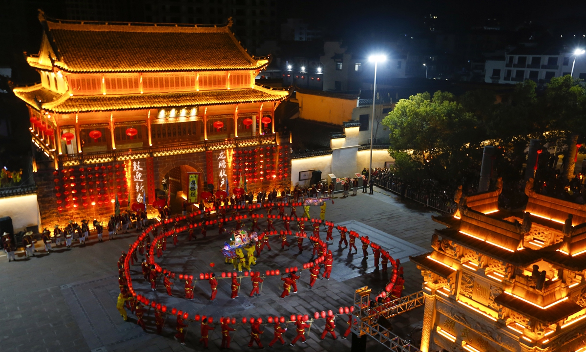 People perform the traditional bench dragon dance ahead of the Lantern Festival, on February 1, 2023 in Huangshan, East China's Anhui Province. Photo: VCG