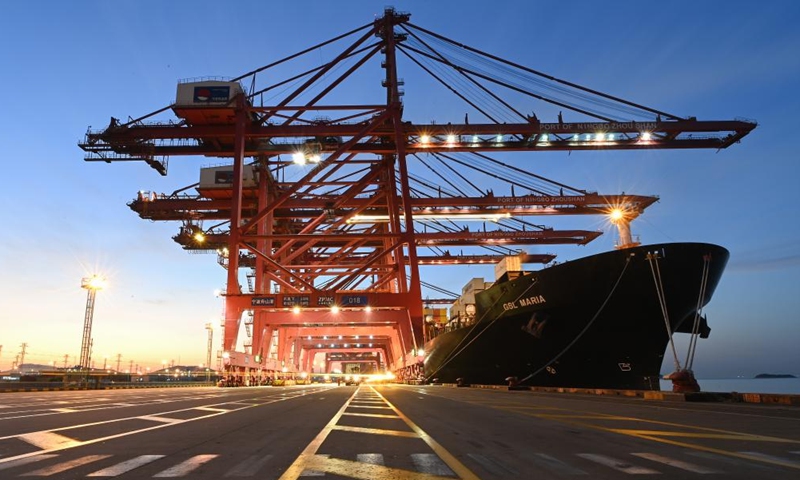 This photo taken on Jan. 31, 2023 shows a cargo ship docking at a container terminal of Ningbo Zhoushan Port in east China's Zhejiang Province. China's busiest port, the Port of Ningbo Zhoushan in the eastern province of Zhejiang, saw its cargo throughput exceed 1.25 billion tonnes in 2022, ranking first globally for a 14th consecutive year, according to the port.(Photo: Xinhua)