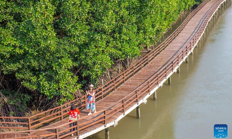 Tourists take photos at a mangrove wetland in Rayong, Thailand, on Feb. 2, 2023. The mangrove wetland in Rayong covers an area of about 80 hectares. February 2 marks World Wetlands Day. This year's theme of World Wetlands Day is It's Time for Wetlands Restoration, highlighting the urgent need to prioritize wetland restoration.(Photo: Xinhua)