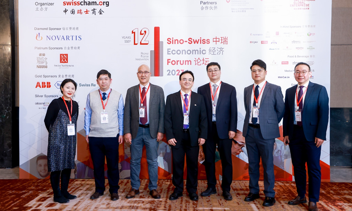 Participants take photos at the Sino-Swiss Economic Forum in Beijing on January 18, 2023. Photo: Courtesy of the Swiss Embassy in China