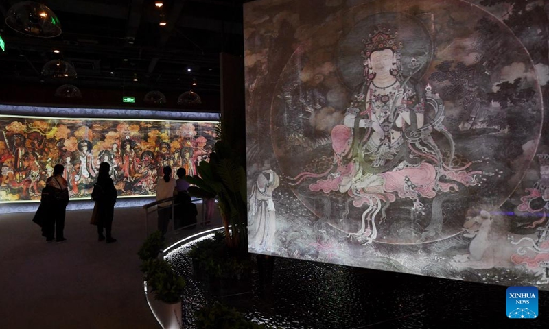 Tourists visit the Fahai Temple Mural Art Center in Beijing, capital of China, Jan. 31, 2022. The art center presents the original mural paintings through 4K HD display and dome screen.(Photo: Xinhua)