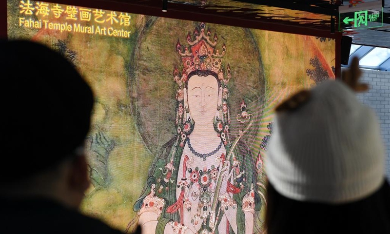 Tourists visit the Fahai Temple Mural Art Center in Beijing, capital of China, Jan. 31, 2022. The art center presents the original mural paintings through 4K HD display and dome screen.(Photo: Xinhua)