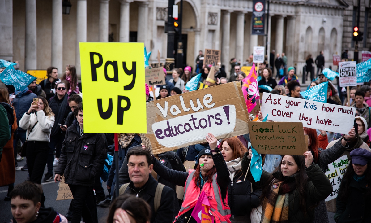 A crowd of activists march along Whitehall during The Public and Commercial Services Union strike in London on February 2. Photo: VCG