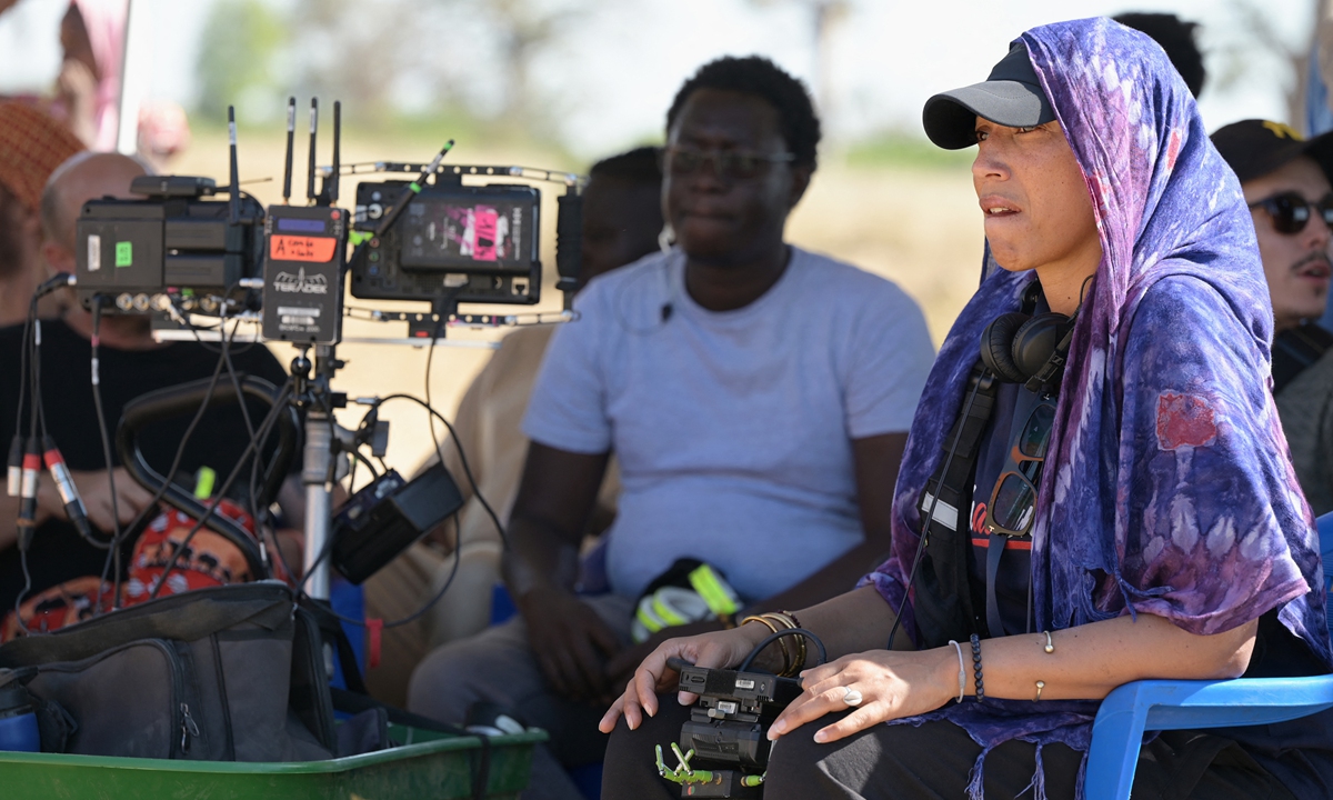 French-Senegalese director Leila Sy (right) looks on during filming on the set of Banlieusards 2 in the forest of Bandia in Sindia, Senegal. File photo: AFP
