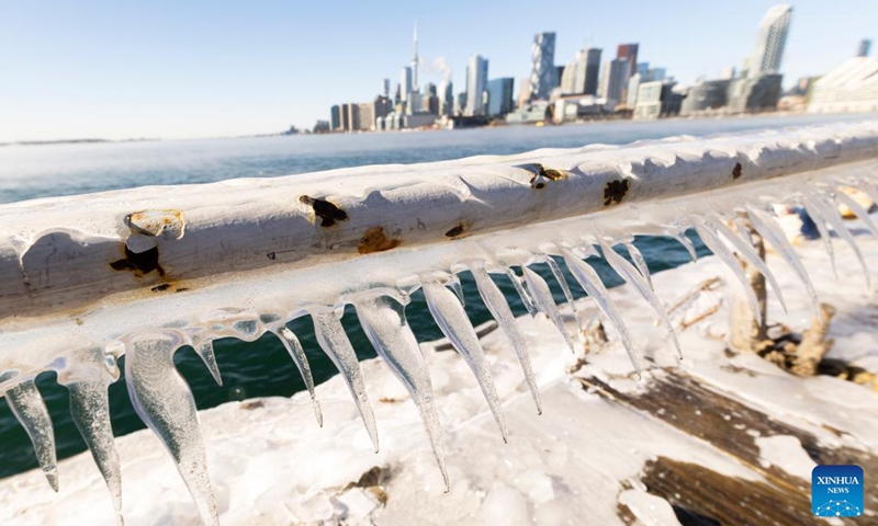 This photo taken on Feb. 3, 2023 shows an ice-covered barrier along Lake Ontario in Toronto, Canada. Environment Canada has issued an extreme cold warning for Toronto on Friday. (Photo by Zou Zheng/Xinhua)