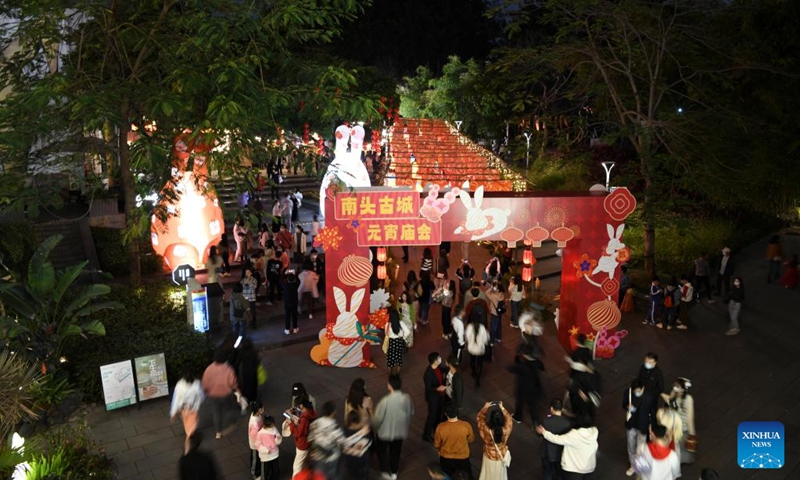 Tourists visit a Lantern Festival fair held in Nantou ancient town in Shenzhen, south China's Guangdong Province, on Feb. 4, 2023. A fair was held in Nantou ancient town to celebrate the upcoming Lantern Festival, which falls on Feb. 5 this year. (Xinhua/Liang Xu)