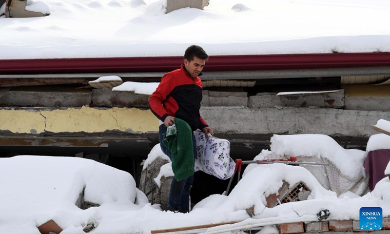 A resident walks in Elbistan district of Kahramanmaras Province, Türkiye, Feb. 7, 2023. The death toll from Monday's powerful earthquakes in southern Türkiye rose to 3,549, said Turkish President Recep Tayyip Erdogan upon declaring that a three-month state of emergency is enacted in 10 affected provinces. Meanwhile, the number of wounded people stood at 21,103, Turkish Disaster and Emergency Management Authority said in an update.(Photo: Xinhua)