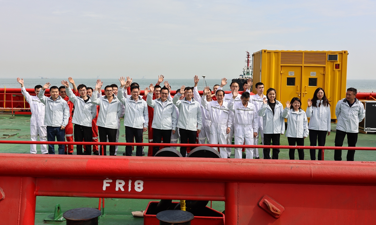 Crew members of <em>Zhong</em> <em>Shan Da Xue Ji Di</em>, China's third icebreaker, wave to the public after they return to a port in Guangzhou, South China's Guangdong on February 3, 2023. Photo:Deng Xiaoci/GT