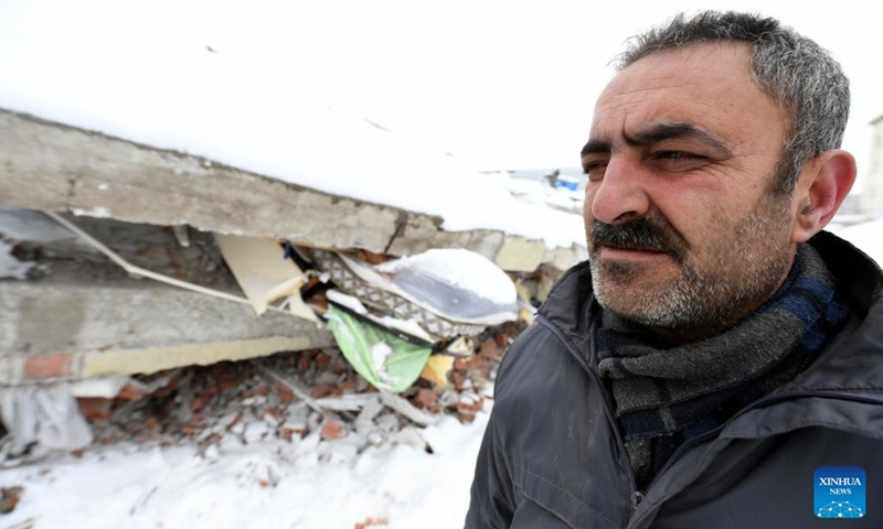 A man stands by a damaged building in Elbistan district of Kahramanmaras Province, Türkiye, Feb. 7, 2023. The death toll from Monday's powerful earthquakes in southern Türkiye rose to 3,549, said Turkish President Recep Tayyip Erdogan upon declaring that a three-month state of emergency is enacted in 10 affected provinces.(Photo: Xinhua)