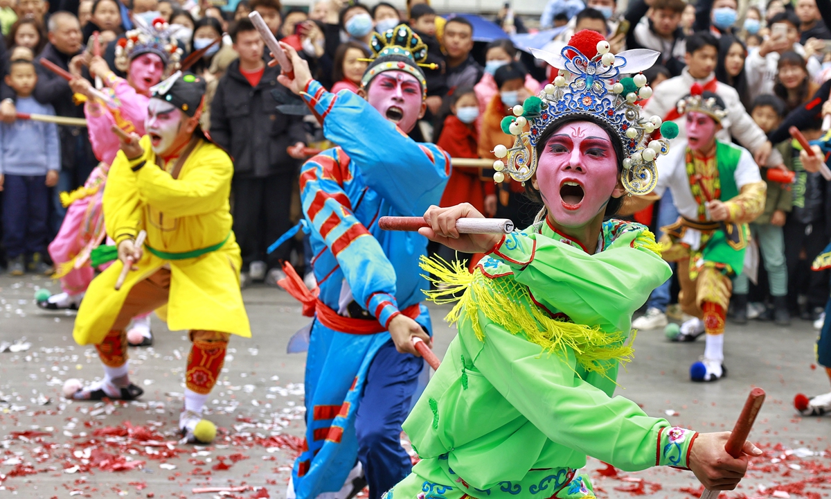 Dancers perform yingge dance on a street in Jieyang, Guangdong Province.