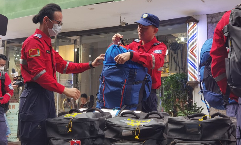 Rescuers of Shenzhen Rescue Volunteers Federation check equipments before departure in Shenzhen, south China's Guangdong Province, Feb. 8, 2023.(Photo: Xinhua)