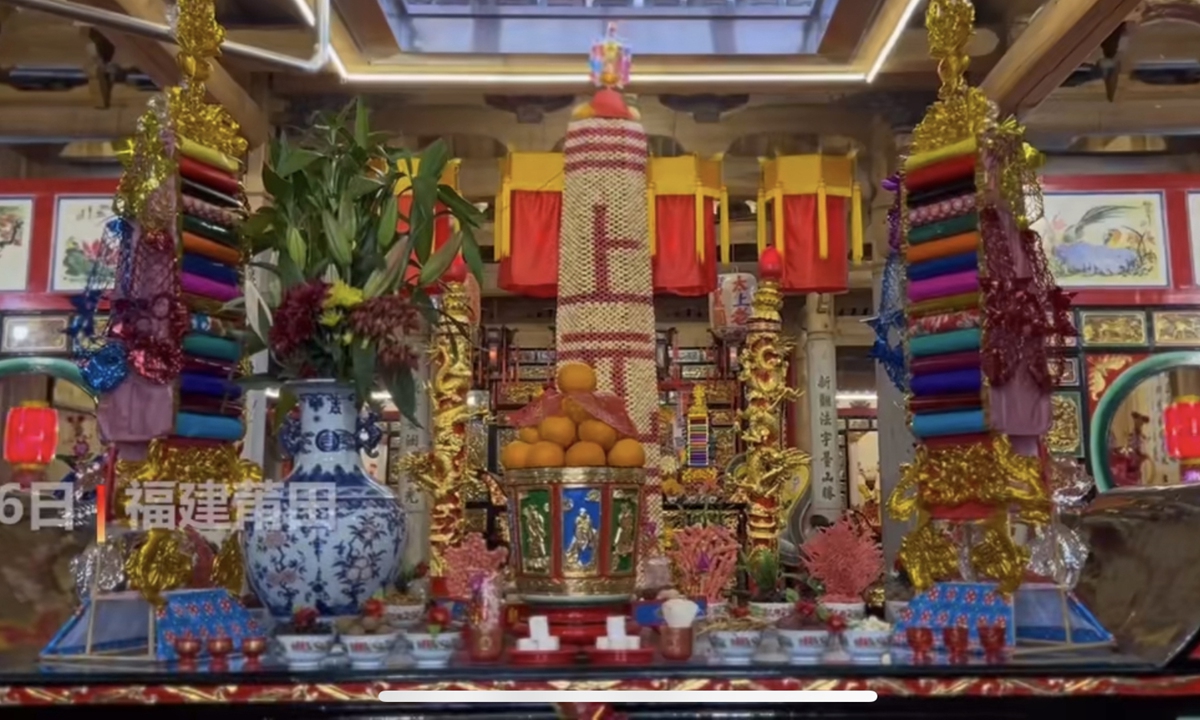 A 365-story, 4-meter-high sugarcane tower made of 180 kilograms of sugarcane was displayed to the public in East China's Fujian Province, implying that life is getting sweeter just like the sugarcane. Photo:IC 
