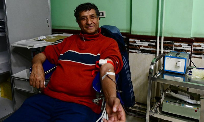 A man donates blood for quake victims at a blood donation center in Damascus, capital of Syria, on Feb. 8, 2023.(Photo: Xinhua)
