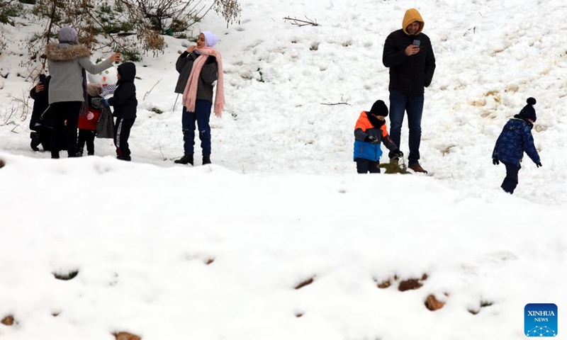 People enjoy the snow in Amman, Jordan, Feb. 8, 2023.(Photo: Xinhua)