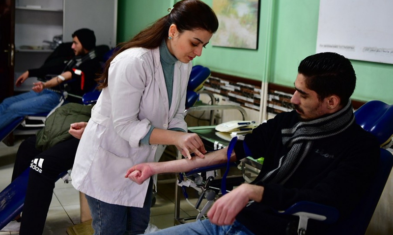 People donate blood for quake victims at a blood donation center in Damascus, capital of Syria, on Feb. 8, 2023.(Photo: Xinhua)