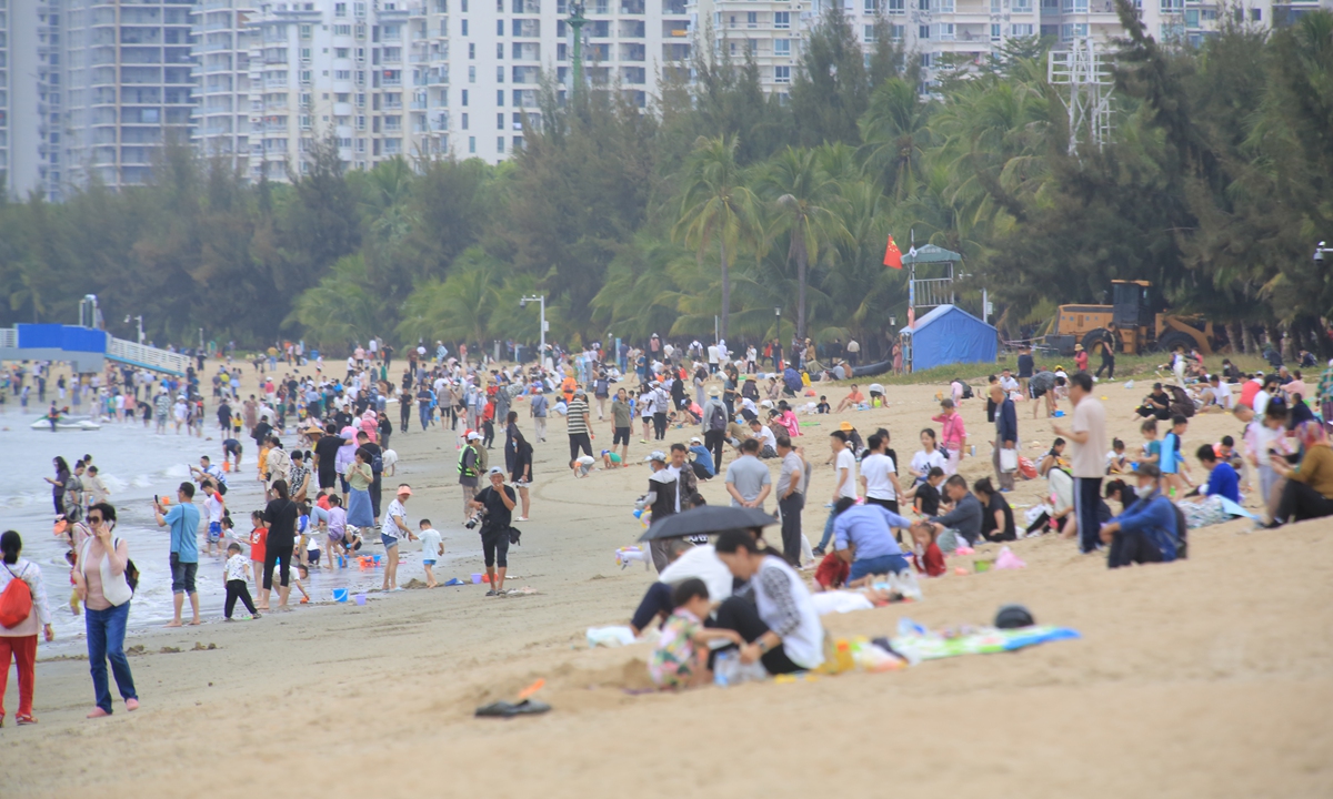 Tourists enjoy a holiday at the beach in Sanya, Hainan Province, on February 3, 2023. Photo: IC