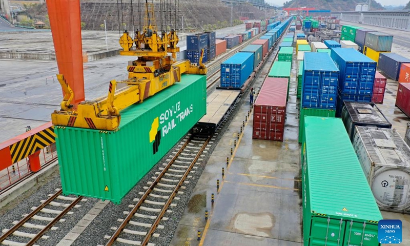 This aerial photo taken on Feb. 9, 2023 shows a China-Europe freight train loading containers at Dulaying Station in Guiyang, southwest China's Guizhou Province. More than 35,000 tonnes of goods has been sent through China-Europe freight train service in Guizhou since its operation on Nov. 18, 2021.(Photo: Xinhua)