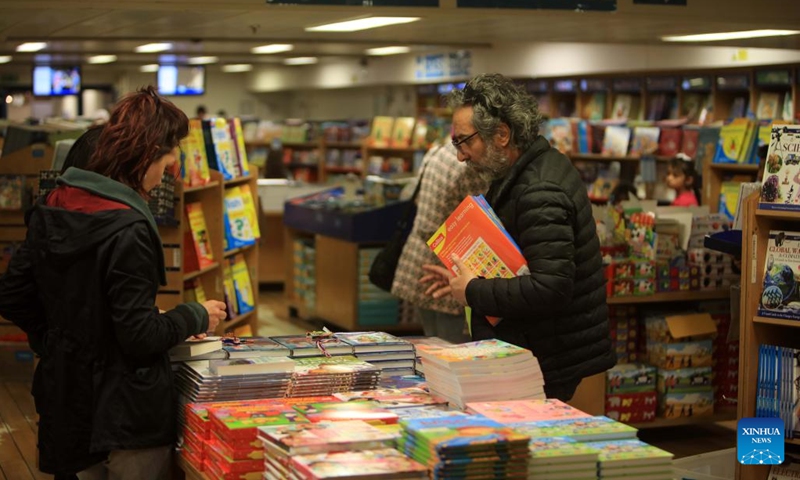 People visit a floating book fair on the library ship Logos Hope in the port of Aqaba, Jordan, on Feb. 13, 2023. The library ship Logos Hope presented a floating book fair with some 5,000 books in a wide range of subjects.(Photo: Xinhua)