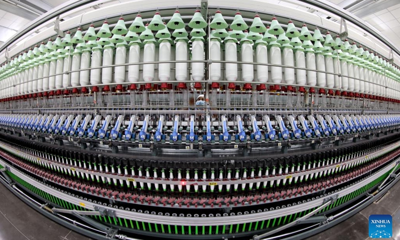 A staff member works at a production line in a new material company in Zaozhuang, east China's Shandong Province, Feb. 11, 2023.(Photo: Xinhua)