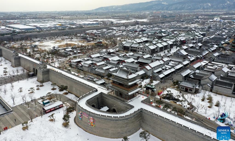 This aerial photo taken on Feb. 13, 2023 shows the snow scenery of the tourist attraction Taiyuan ancient county in Taiyuan, capital of north China's Shanxi Province.(Photo: Xinhua)
